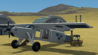 C-7 Wheet loads mail for a flight over the Kulge Desert