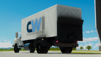 The box truck features a powered lift gate in the rear for easy loading.